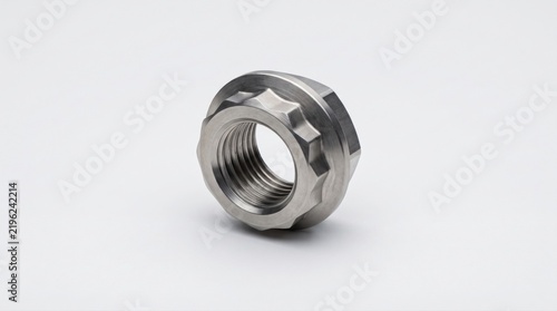 Macro shot of a single titanium flange nut isolated on a clean white background for industrial use