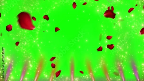 Falling red rose petals drifting downward through glowing sparkling lights set against a vibrant green screen background created for romantic video editing and digital compositing projects.