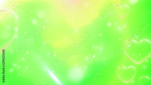Heart bokeh animation features glowing symbols floating gently across a vibrant green background, creating a romantic and festive atmosphere for video editing and digital projects.
