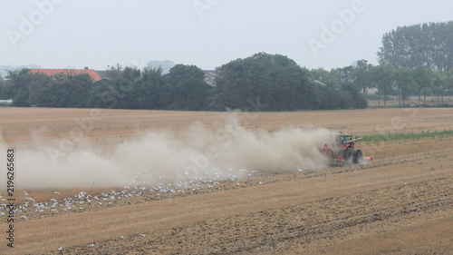 Fototapeta a tractor ploughing