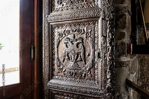 Traditional Byzantine double headed eagle symbol carved on a wooden door in Holy Church of Saint Lazarus in Larnaca in Cyprus