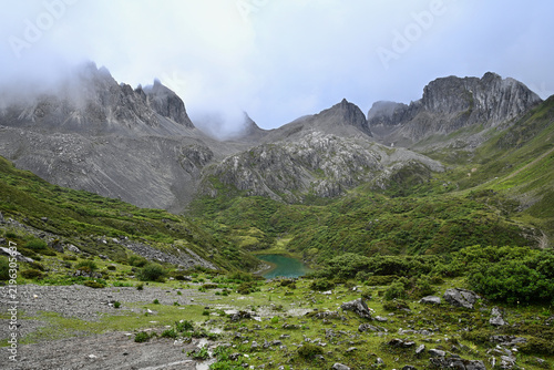 Stunning High-Altitude Lake Abujicuo Surrounded By Glacial Mountains in Shangri-La, Yunnan Province, China