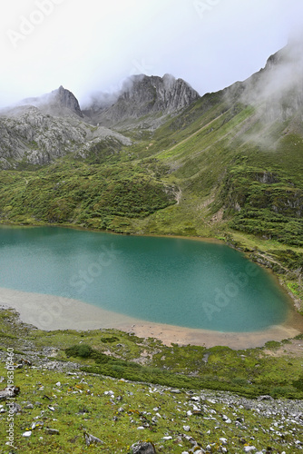Pristine Glacial Waters of Abujicuo Lake Surrounded by Alpine Wilderness in Shangri-La, China