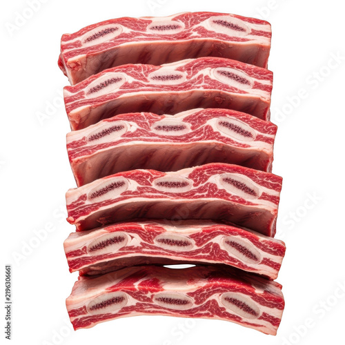 Stacked raw beef ribs isolated on transparent background