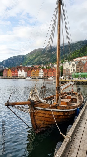 Traditional wooden boat moored in Bergen harbor Norway