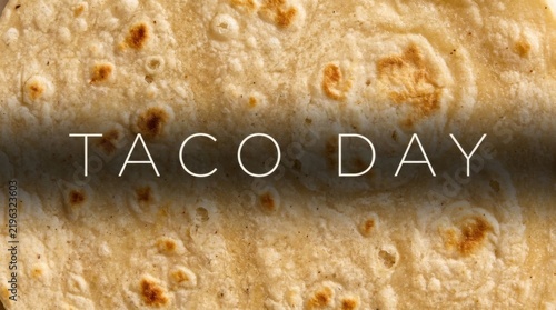 Macro Texture of Toasted Flour Tortilla Wrap with Taco Day Typography