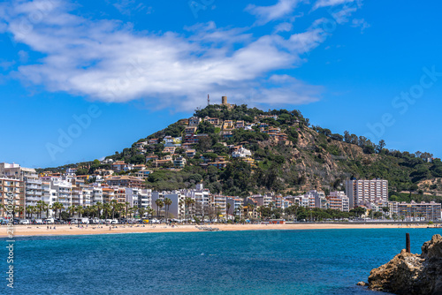 Beautiful view of mountain Sant Joan with the castle and Blanes beach at Costa Brava coast in summer on sunny day, Selva, Girona Catalonia, Spain