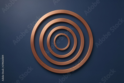 Five concentric brushed copper rings on a matte navy background
