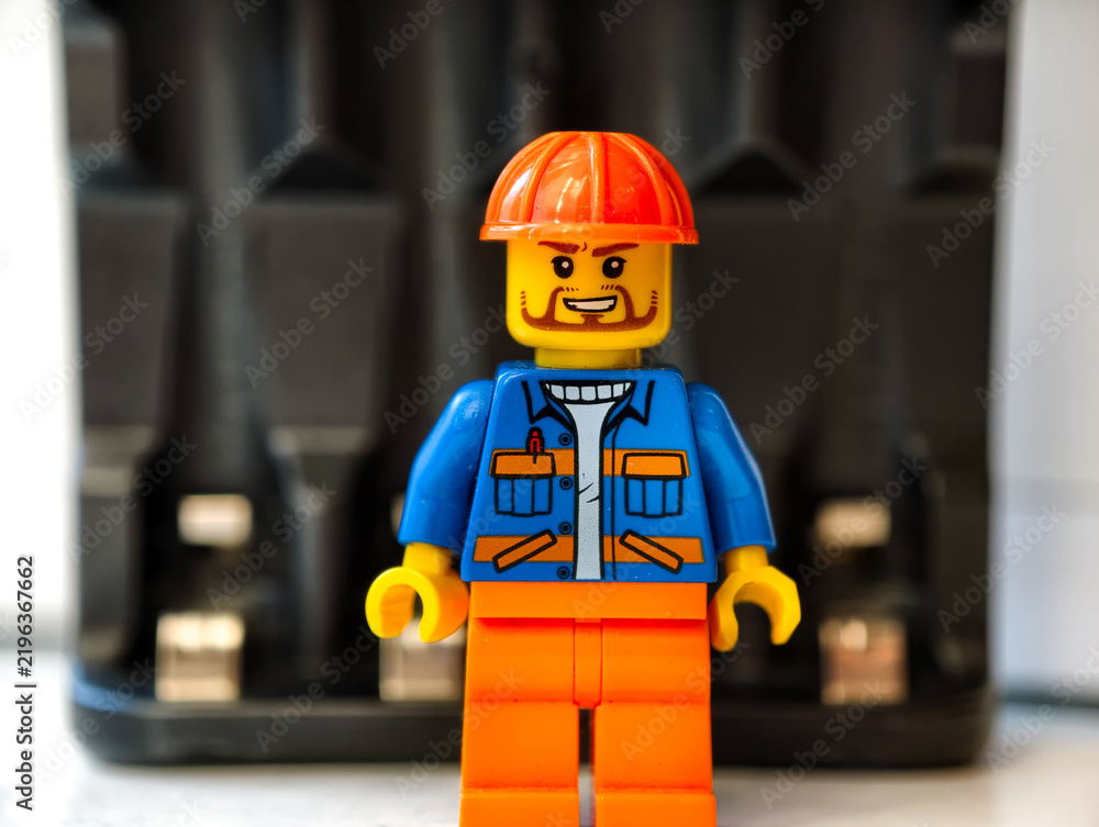 Obraz premium Russia, St. Petersburg, August 8, 2020 Close up of a Lego man wearing a hard hat, useful for illustrations and designs