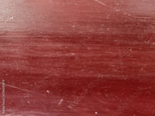 Foto Red mahogany wood grain texture with dark horizontal patterns provides elegant surface background for luxury furniture design and professional carpentry projects