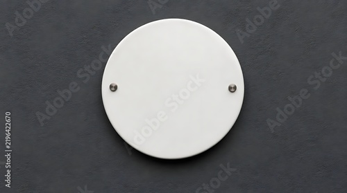 Blank circular white sign mockup mounted on a dark textured wall with two metal screws, perfect for minimalist corporate branding, logo display, or architectural signage presentation.