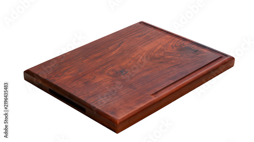 Foto Isolated dark reddish-brown wooden cutting board with juice groove and convenient handle