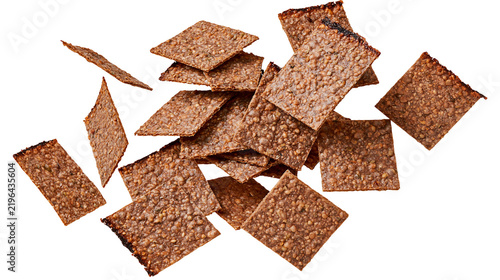 Bild auf Leinwand Isolated delicious crispy multigrain seed crackers, savory healthy snack, rustic