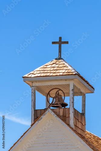 Steeple with brass bell on an old, abandoned church