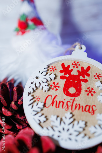 Wooden christmas ornament featuring reindeer and snowflakes