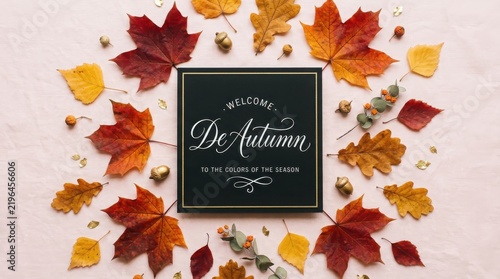 Autumn leaves frame a dark invitation with elegant calligraphy