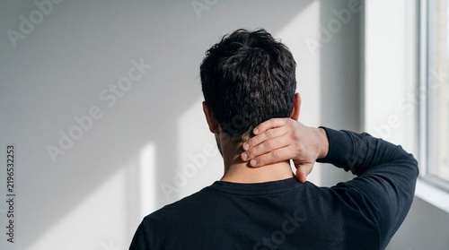 Person Clutching Back of Neck in Pain for Healthcare and Medical Advertising Banner