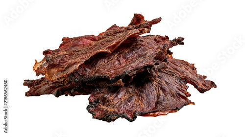Cuadro en lienzo Isolated pile of crispy dried beef jerky pieces with a fibrous texture and rich