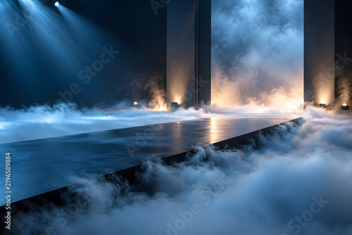 Empty dark runway stage with blue spotlights and rolling smoke