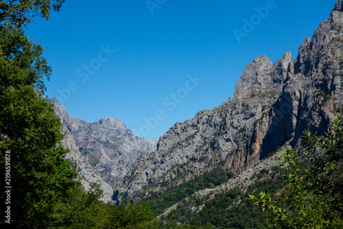 rugged peaks and iconic limestone peak of the Naranjo de Bulnes - also known as Picu Urriellu - in the Picos de Europa National Park in northern Spain