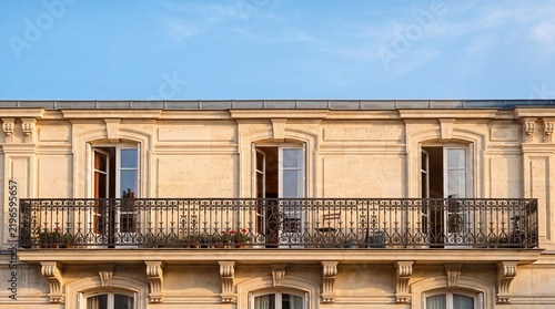 Classic Parisian Stone Facade with Wrought Iron Balcony