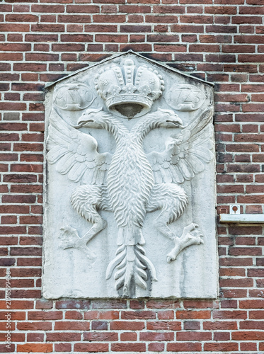 Aachen, Germany, Europe - July 29, 2026: On side of City Hall: Relief showing the crowned double-headed Imperial Eagle, Reichsadler. It is the emblem of Emperor Charles VI (Karl VI), Holy Roman Empero