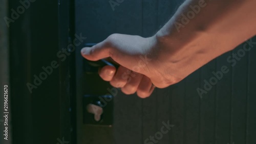 Man Hand Opening Modern Front Door from Inside | Close-Up Grabbing Door Handle Pushing Forward | Home Entrance Security Concept