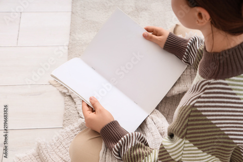 Education and self-improvement, woman reading a blank open book for study or ...
