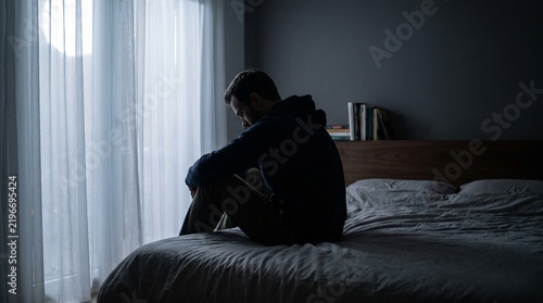 Lonely Adult Man Sitting on Bed Representing Mental Health Challenges Emotional Stress Isolation and Personal Reflection