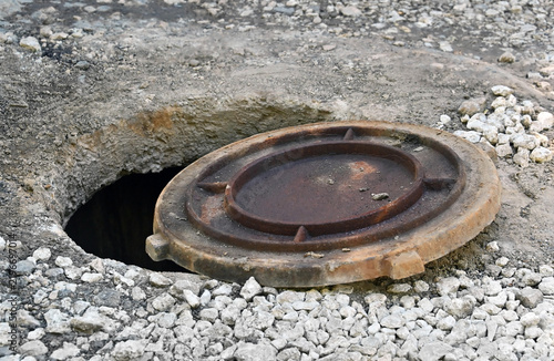 Open manhole cover