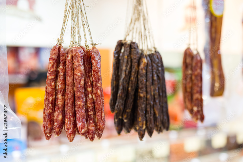 Fototapeta premium Traditional meat sausage hanging in a local market