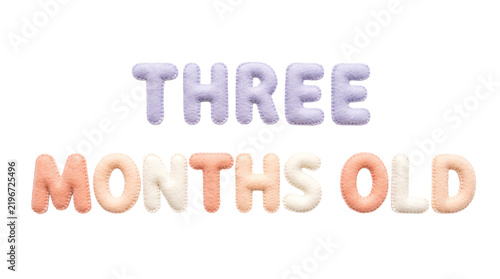 Three months old text made of pastel felt letters on transparent background. Handmade stitched fabric alphabet. Baby milestone and infant growth tracking concept.