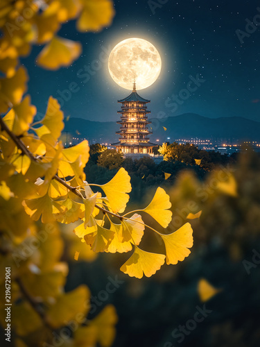 Full Moon Above Illuminated Ancient Pagoda with Ginkgo Foreground