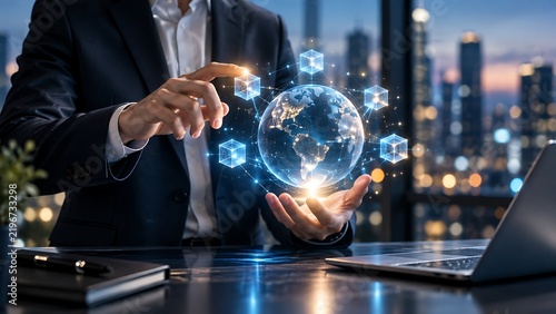 Businessman holding glowing globe with digital network, symbolizing global business and technology.
