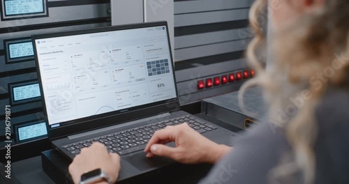 Female IT Specialist Responds to Cyber Attack Alert Using Linux Command Line, Reviewing Server Telemetry and Performing Emergency Recovery Steps During Critical Infrastructure Security Incident.