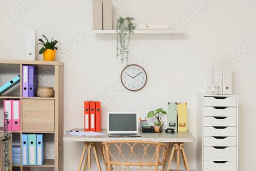 Remote work and home office organization, modern workspace with laptop and co...