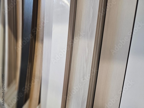 Display of wooden panels in various colors arranged in a row