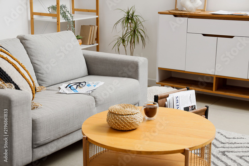 Work-life balance and leisure time, cozy living room interior with coffee and...