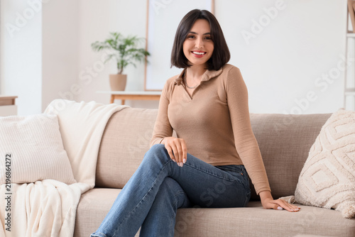 Konstfotografi Work-life balance and mental wellness, happy young woman relaxing on a comfortab