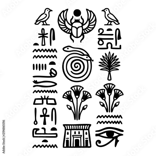 Ancient Egyptian hieroglyphs set with scarab beetle and sacred symbols