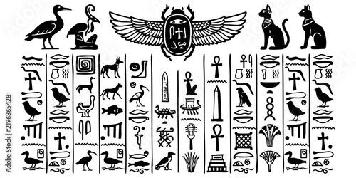 Ancient Egyptian hieroglyphs set with winged scarab beetle and traditional symbols