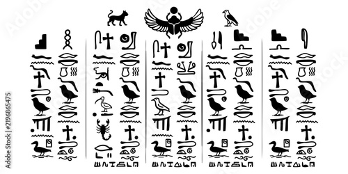Ancient Egyptian hieroglyphs set with winged scarab symbols on white background