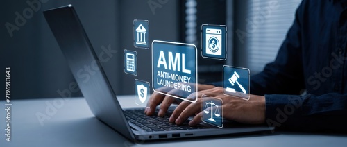 Person using laptop with anti money laundering concept