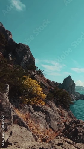 Turquoise Ocean Waves Along a Dramatic Rocky Coastal Cliff