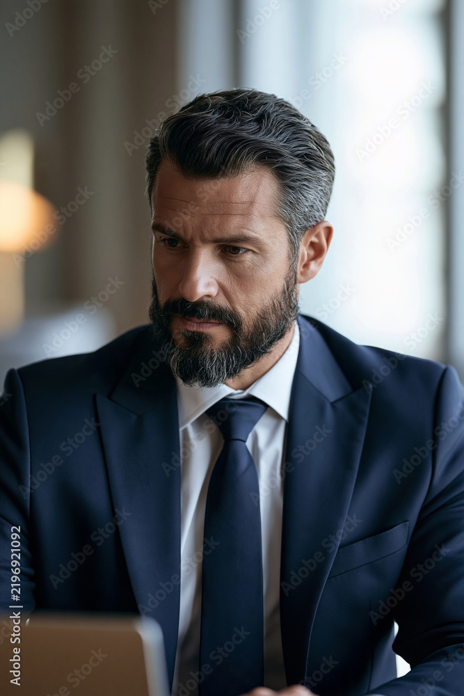 Fototapeta premium employee learning phishing awareness on laptop, bright office, realistic corporate stock photo