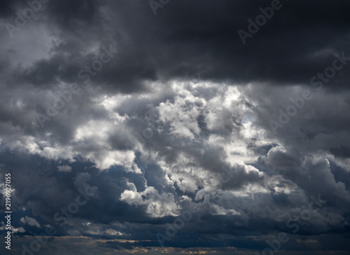 Dramatic sky. Dark storm clouds are forming over the eastern plains of Colorado, and rain streams are visible in the distance. A dramatic scene showcasing severe storms, climate, and atmospheric condi