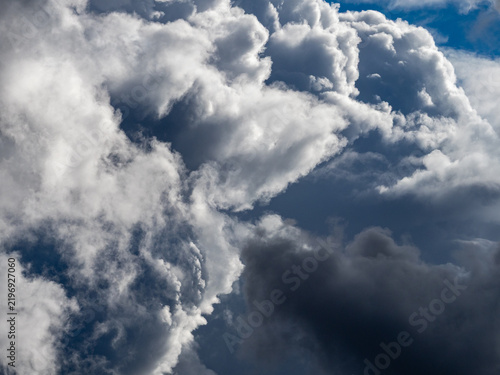 Dramatic sky. Dark storm clouds are forming over the eastern plains of Colorado, and rain streams are visible in the distance. A dramatic scene showcasing severe storms, climate, and atmospheric condi