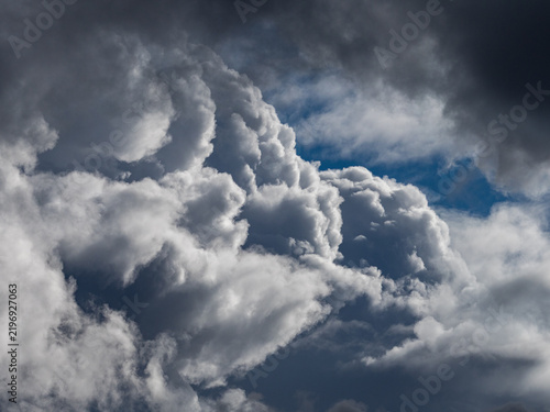 Dramatic sky. Dark storm clouds are forming over the eastern plains of Colorado, and rain streams are visible in the distance. A dramatic scene showcasing severe storms, climate, and atmospheric condi