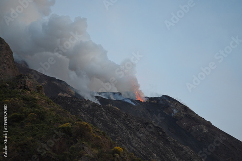 Erupting Volcano and Smoke Plume at Twilight in Stromboli, Italy