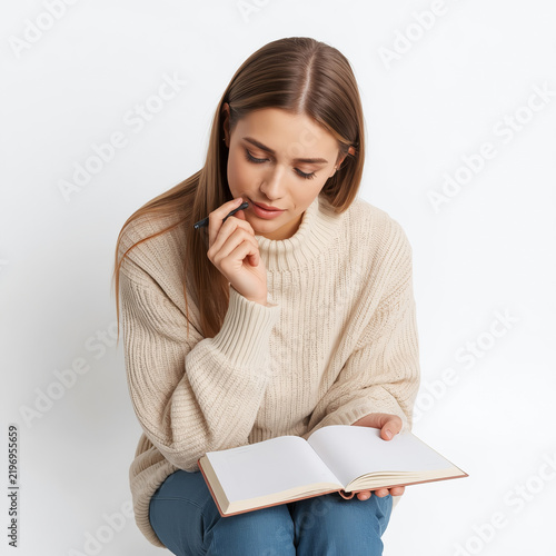 Woman Writing New Year Resolutions
